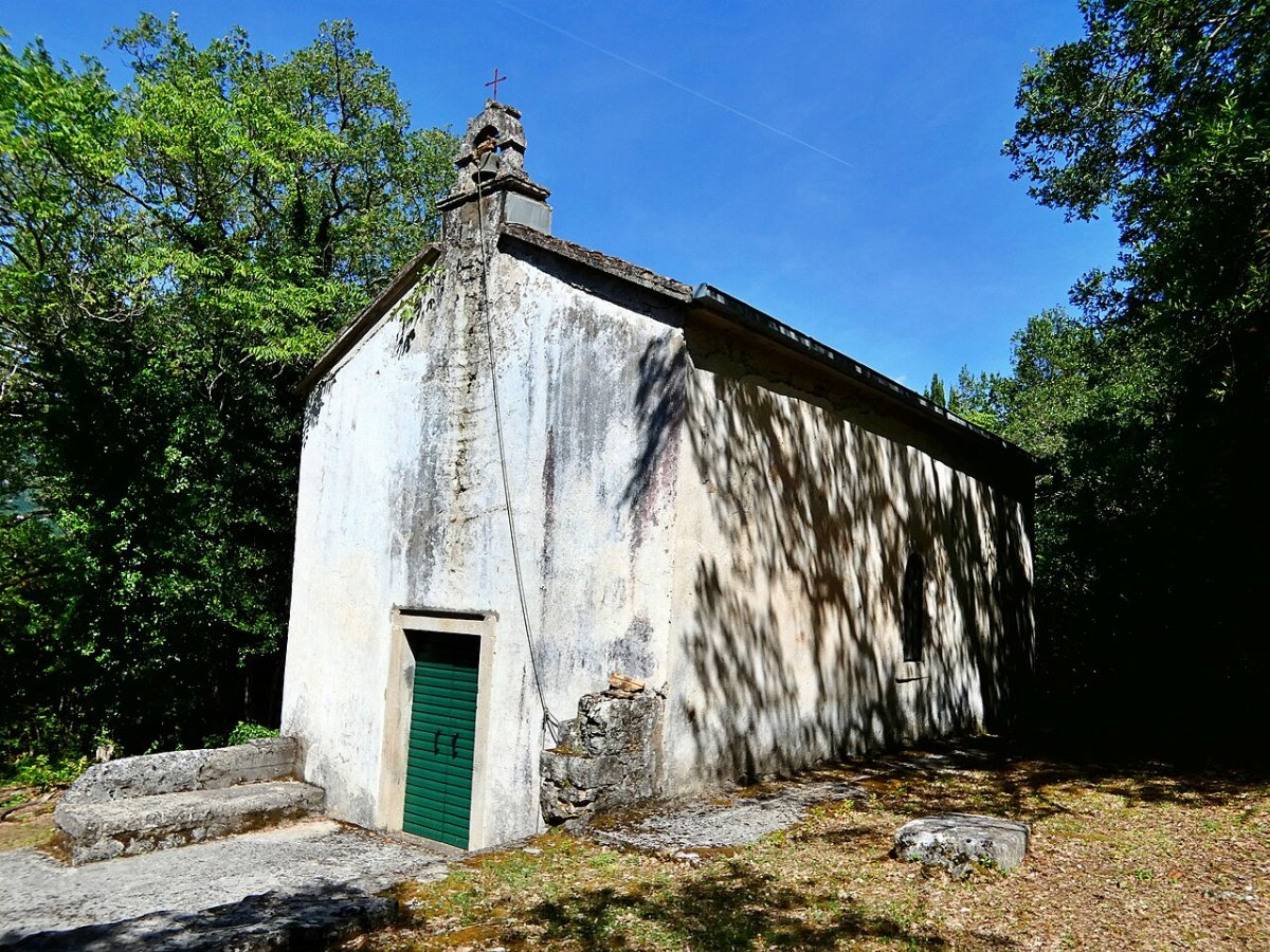 Church of st peter the apostle with medieval cemetery plocice
